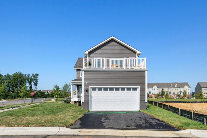 rear exterior with garage and terrace