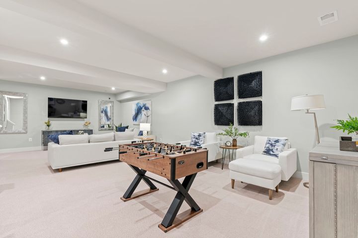 recreation room with couches and tabletop games