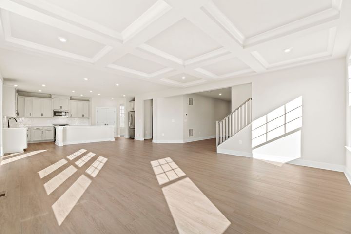 family room with coffered ceiling