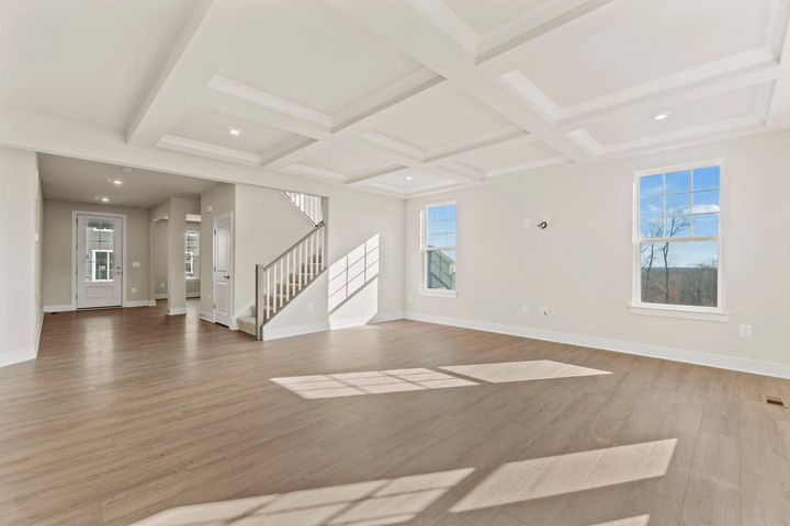 family room next to stairs to upper level