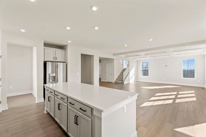 kitchen with large island with cabinets and drawers