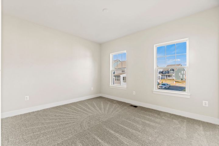 bedroom with with two large windows