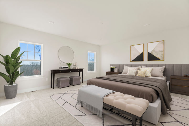 Primary bedroom with high ceilings