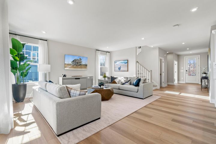 family room next to foyer and stairs