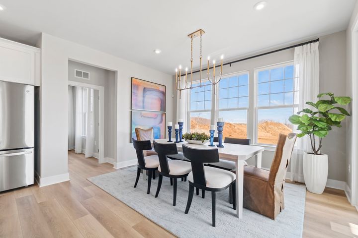 dining area in front of 3 large windows