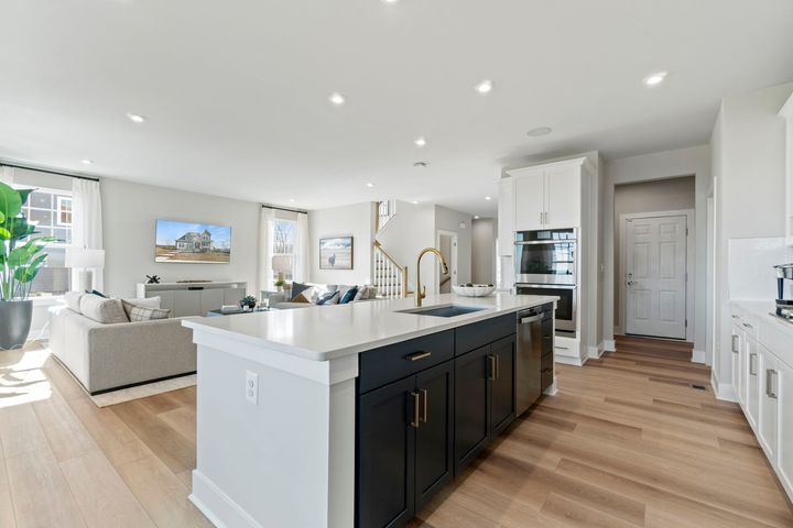 kitchen with island sink and dishwasher