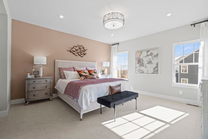 primary bedroom with bright windows