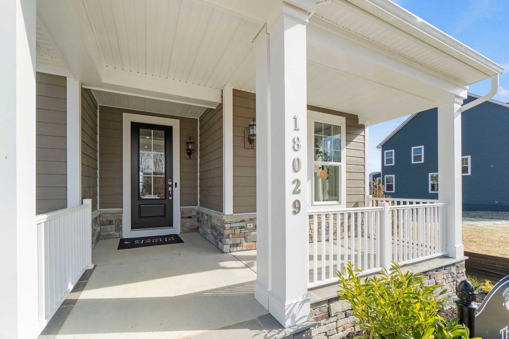 front porch with railing in potomac shores