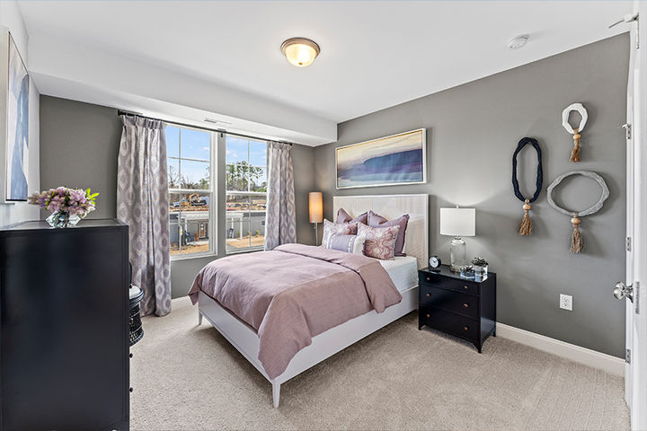 bedroom with bright windows