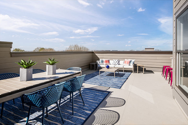 rooftop terrace with dining and sitting area