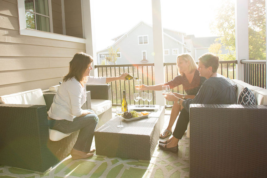 Friends enjoying backyard patio