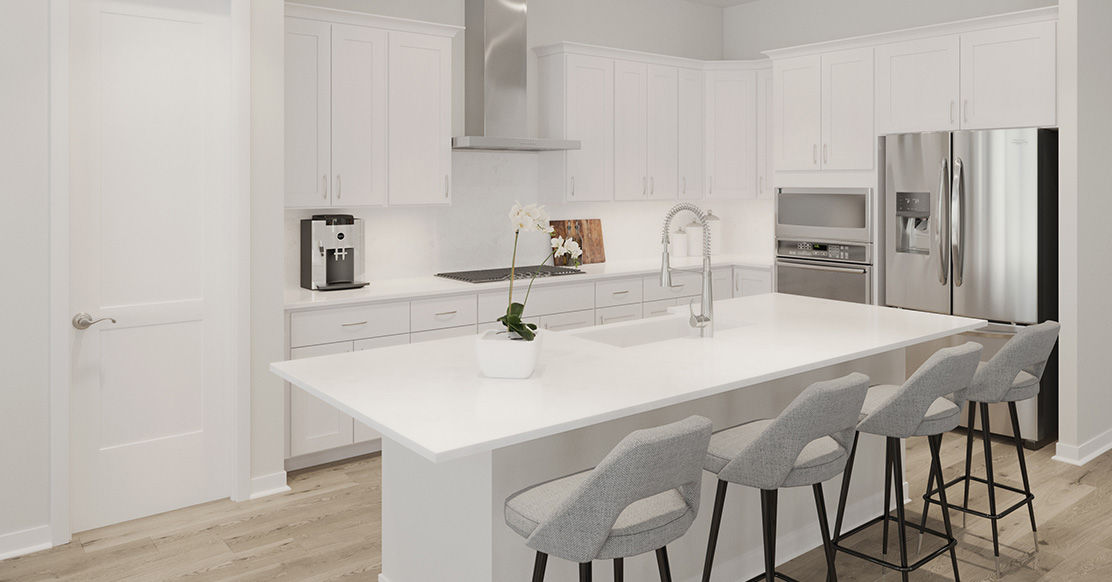 bright white kitchen with large island and counter seating