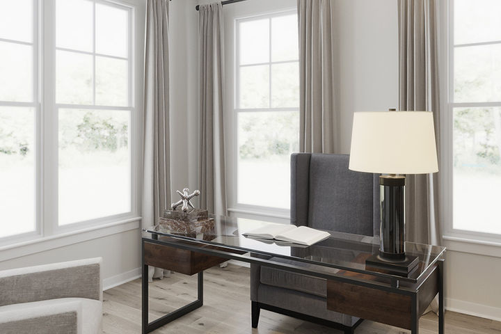 private library with desk in front of windows