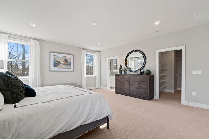 serene primary bedroom with king bed