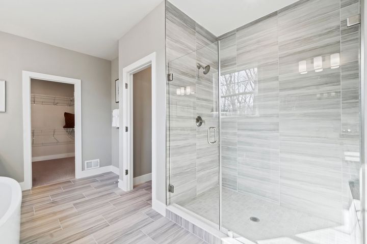 primary bath with glass enclosed shower