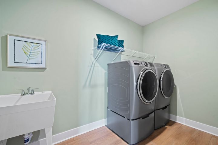 laundry room with sink and shelves