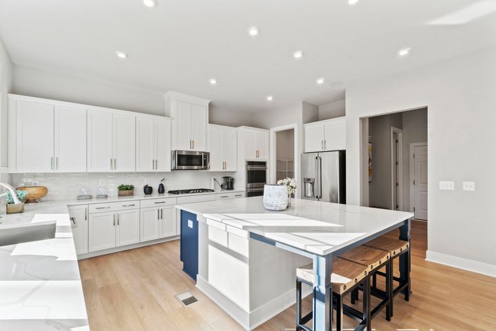 kitchen with white cabinets and countertops
