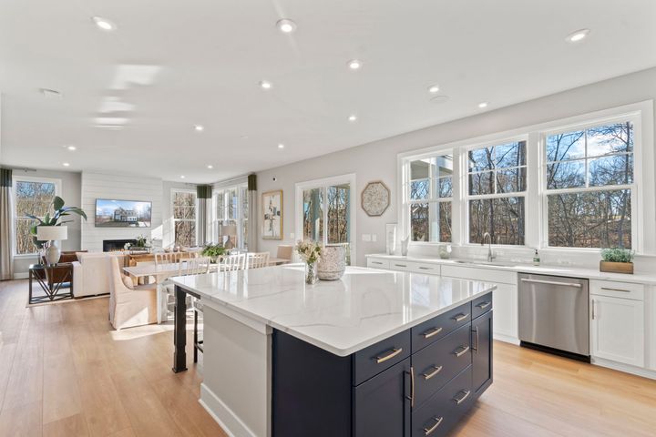 open kitchen flowing to dining area and family room