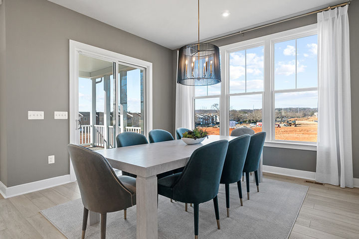 dining area with 8 person table next to deck