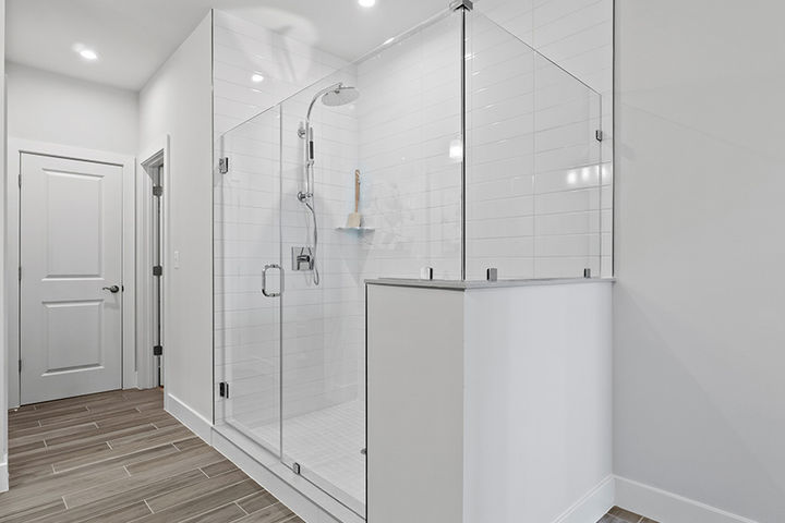 primary bath with glass enclosed shower