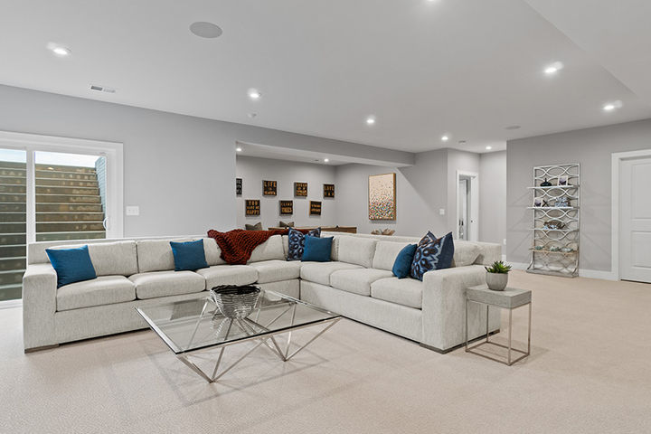 lower level recreation room with huge sectional sofa