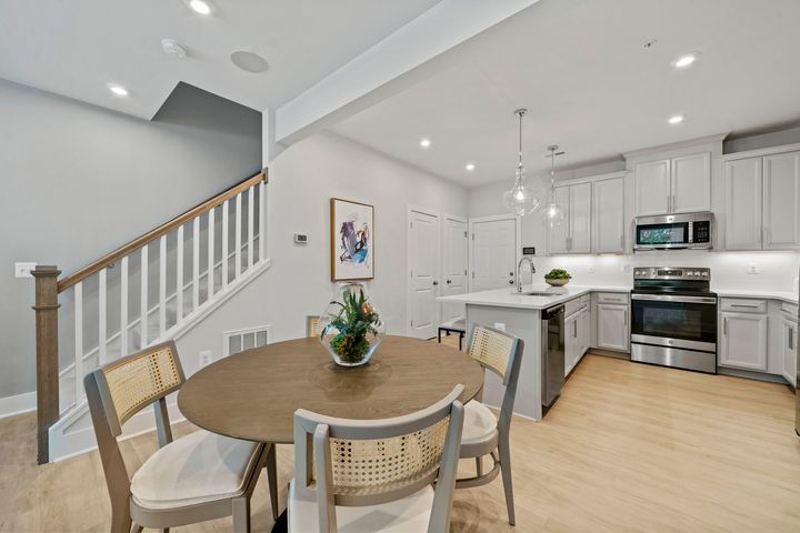 dining table next to open kitchen