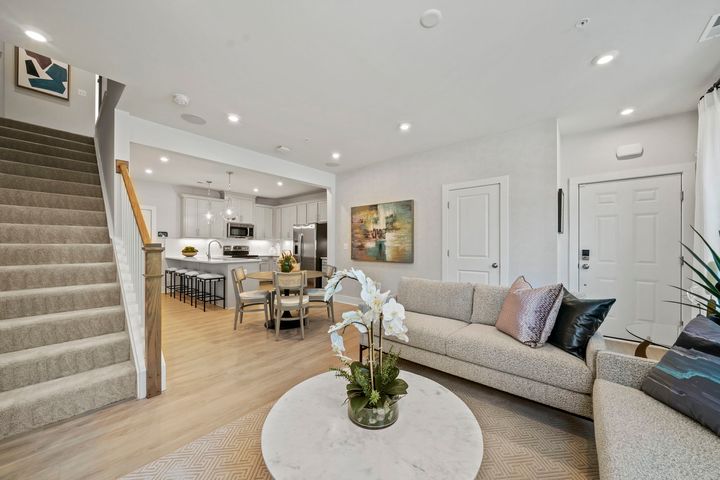 family room next to foyer and staircase