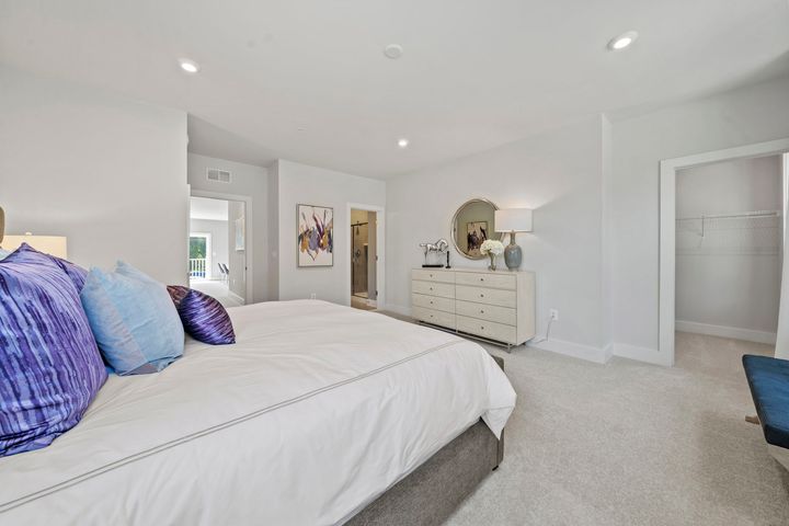 primary bedroom with walk in closet