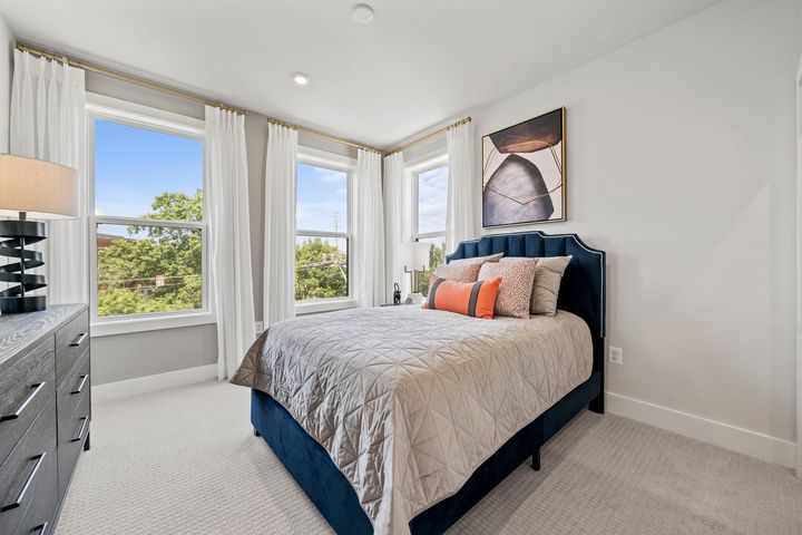 bedroom with queen size bed and dresser