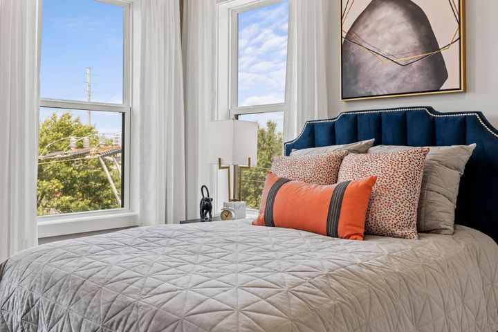 bedroom with bright windows