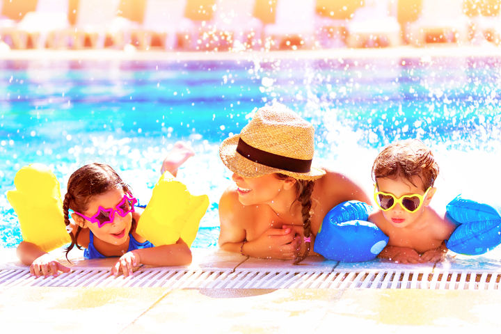 woman swimming with kids