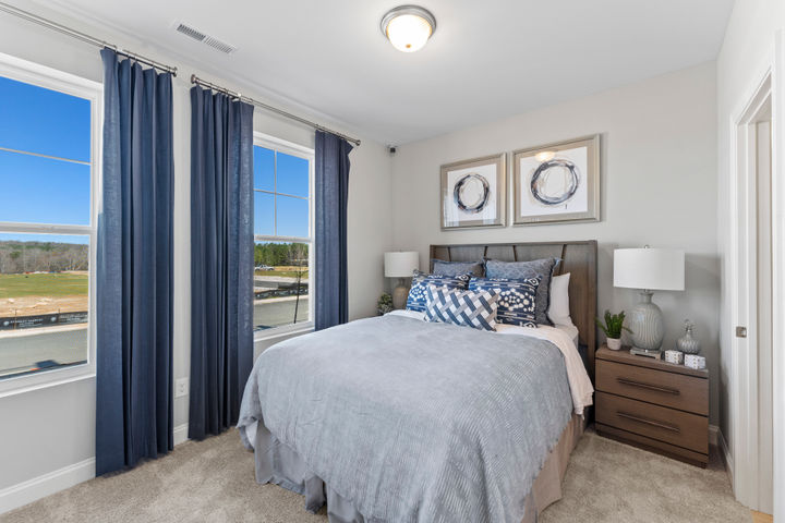 bedroom with large bright windows