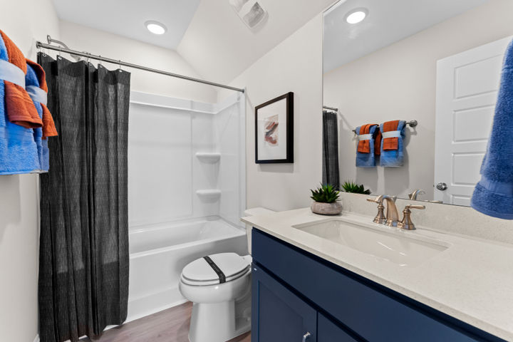 loft level bathroom with tub shower