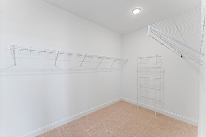 walk in closet in primary bedroom