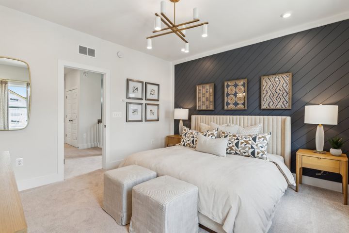 Serene primary bedroom with ensuite bath and walk in closets