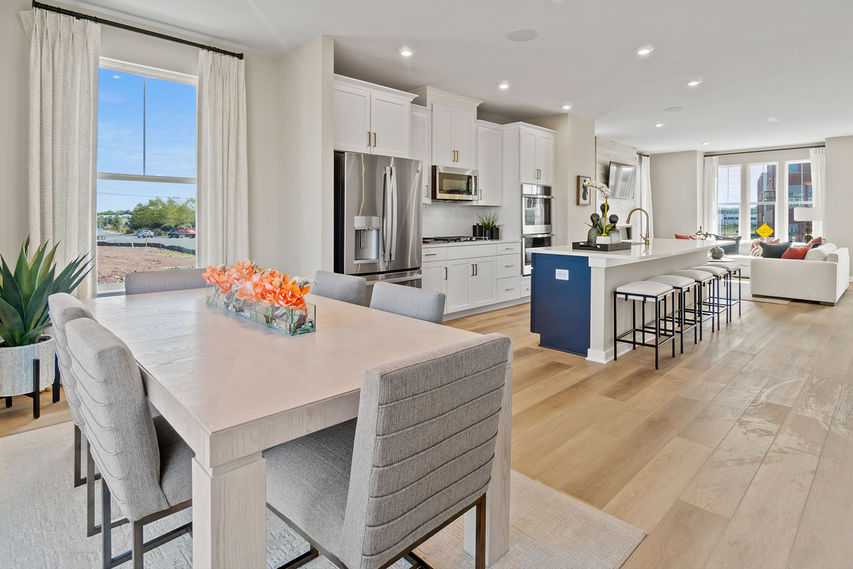 open concept main level floorplan with kitchen in center