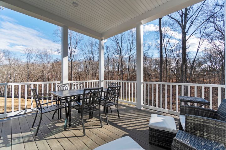 covered porch backing to woods