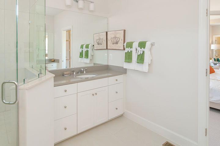 primary bath with cabinet vanity