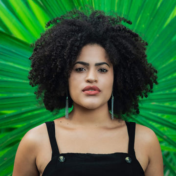 A woman with a green background