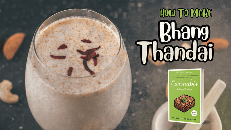 A promotional banner featuring a tall glass of Bhang Thandai, a frothy, spiced milk beverage topped with saffron strands. Beside the glass is a book titled "Cannabis: A Global History" by Bradley J. Borougerdi. The image includes large, stylized text that reads "HOW TO MAKE Bhang Thandai" against a dark, textured background with scattered cashews.