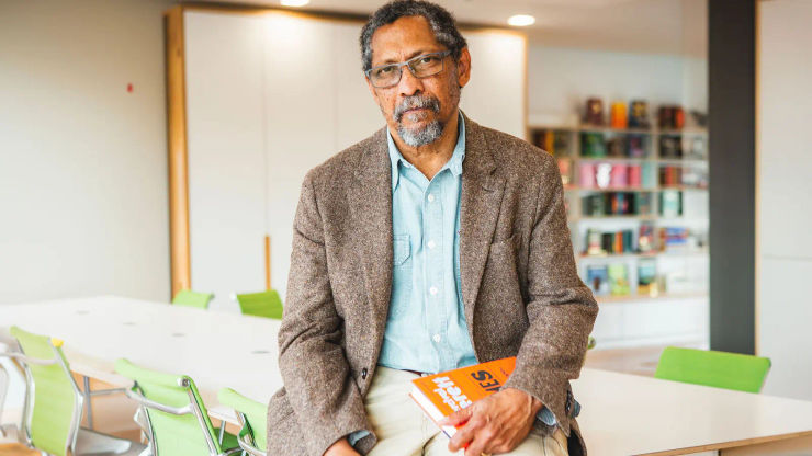 Percival Everett in the Pan Macmillan office holding a copy of James.