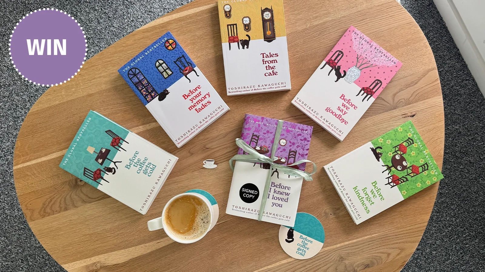 6 before the coffee gets cold books on a table with coffee, coasters and pin badge