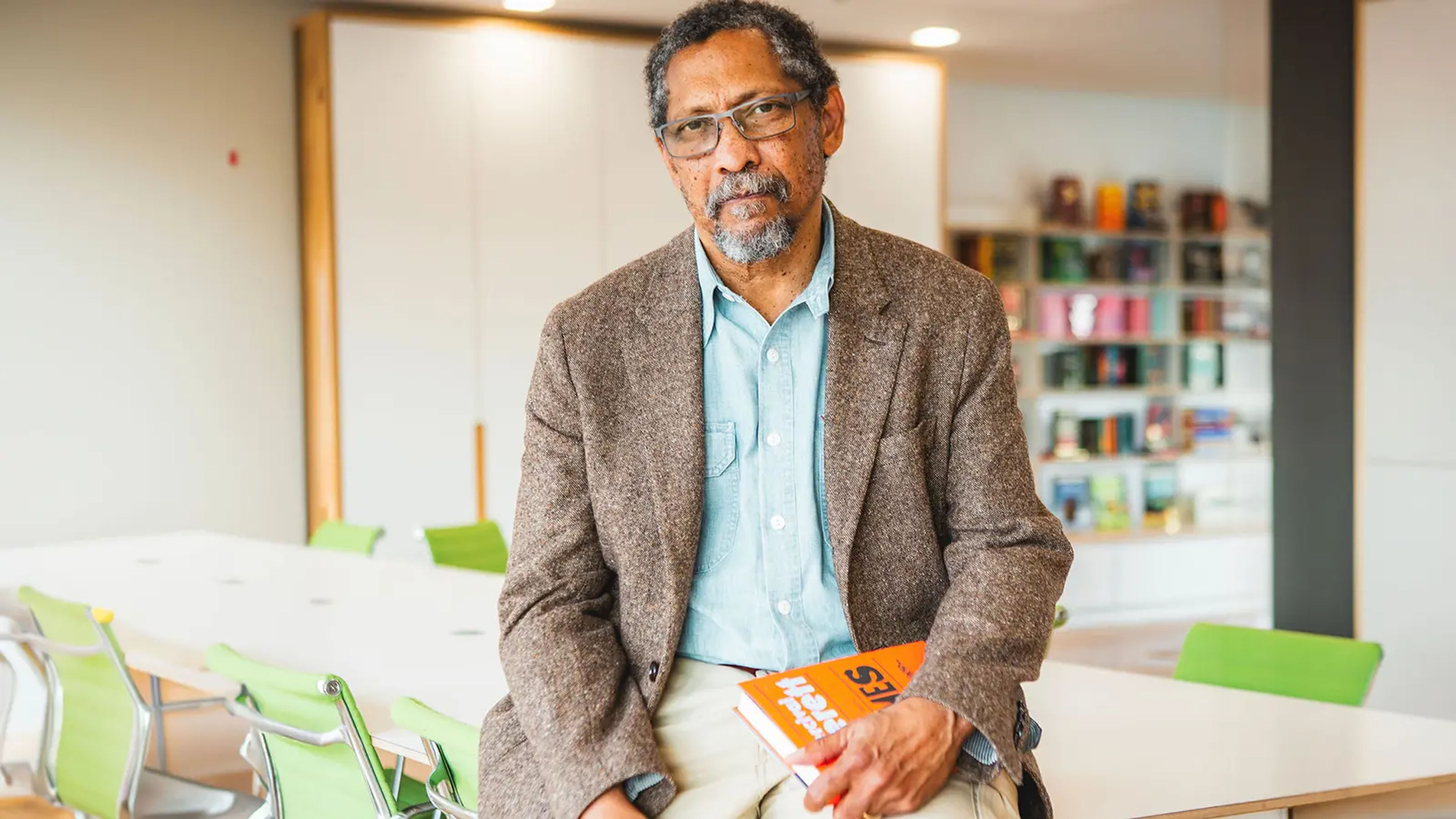 Percival Everett in the Pan Macmillan office holding a copy of James.
