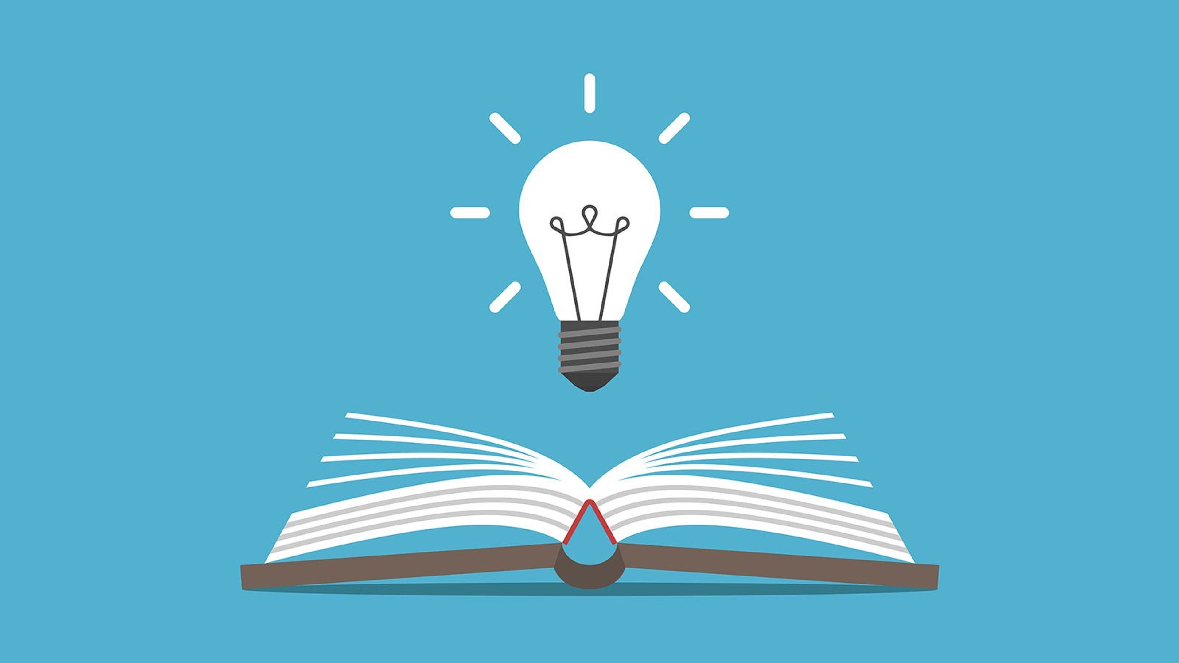 An illustration of a light bulb over a book