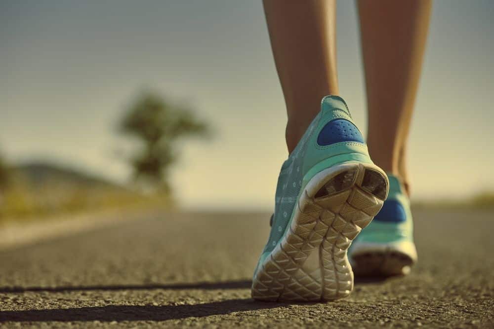 Athlete feet in running shoes jogging on the road - Running Gear for Beginners Athlete feet in running shoes jogging on the road - Running Gear for Beginners