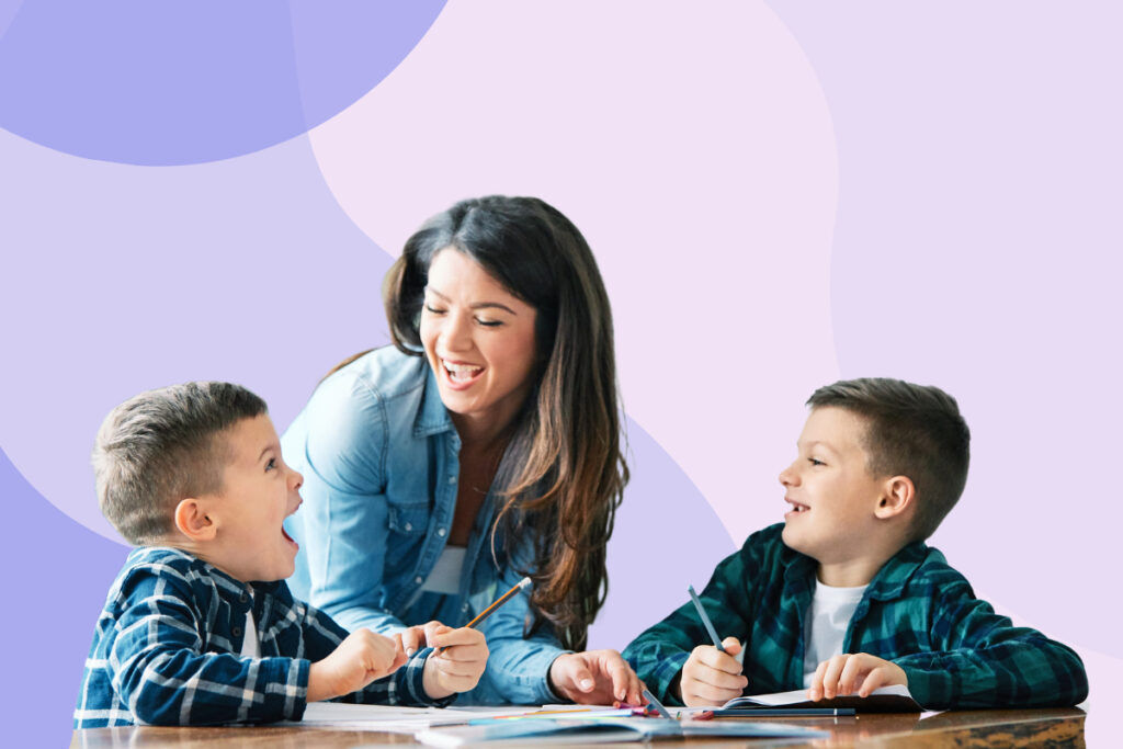 Woman having fun teaching her two kids.