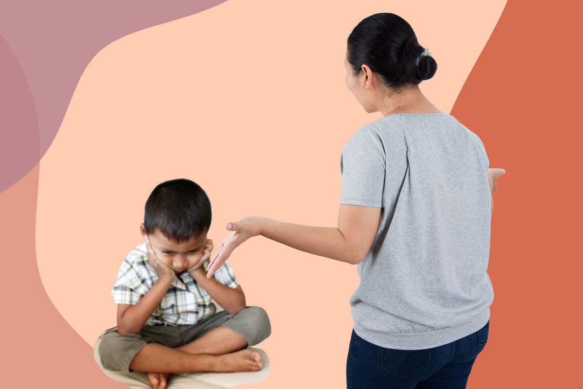 A mother stands yelling at her child, who is sitting with his face in his hands.