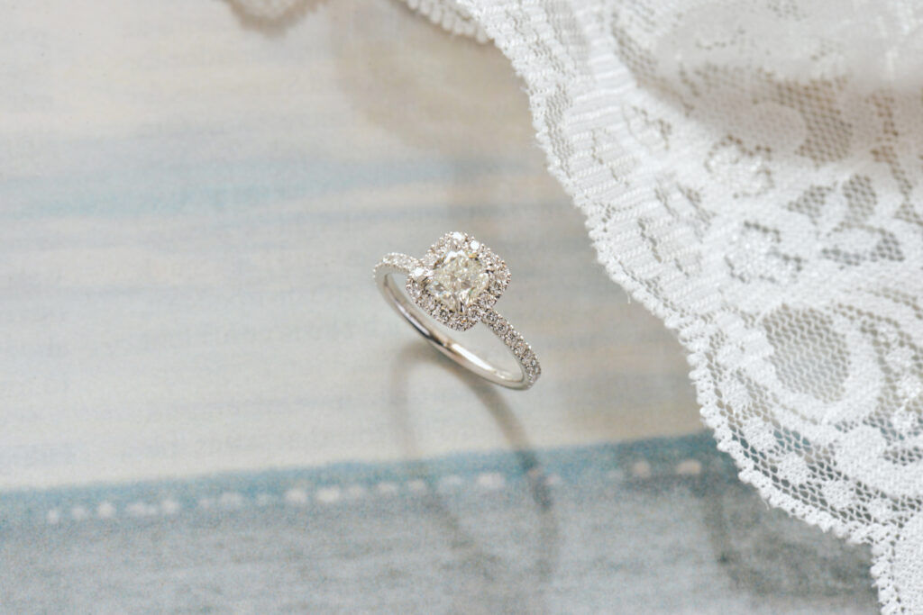 white gold cushion halo engagement ring