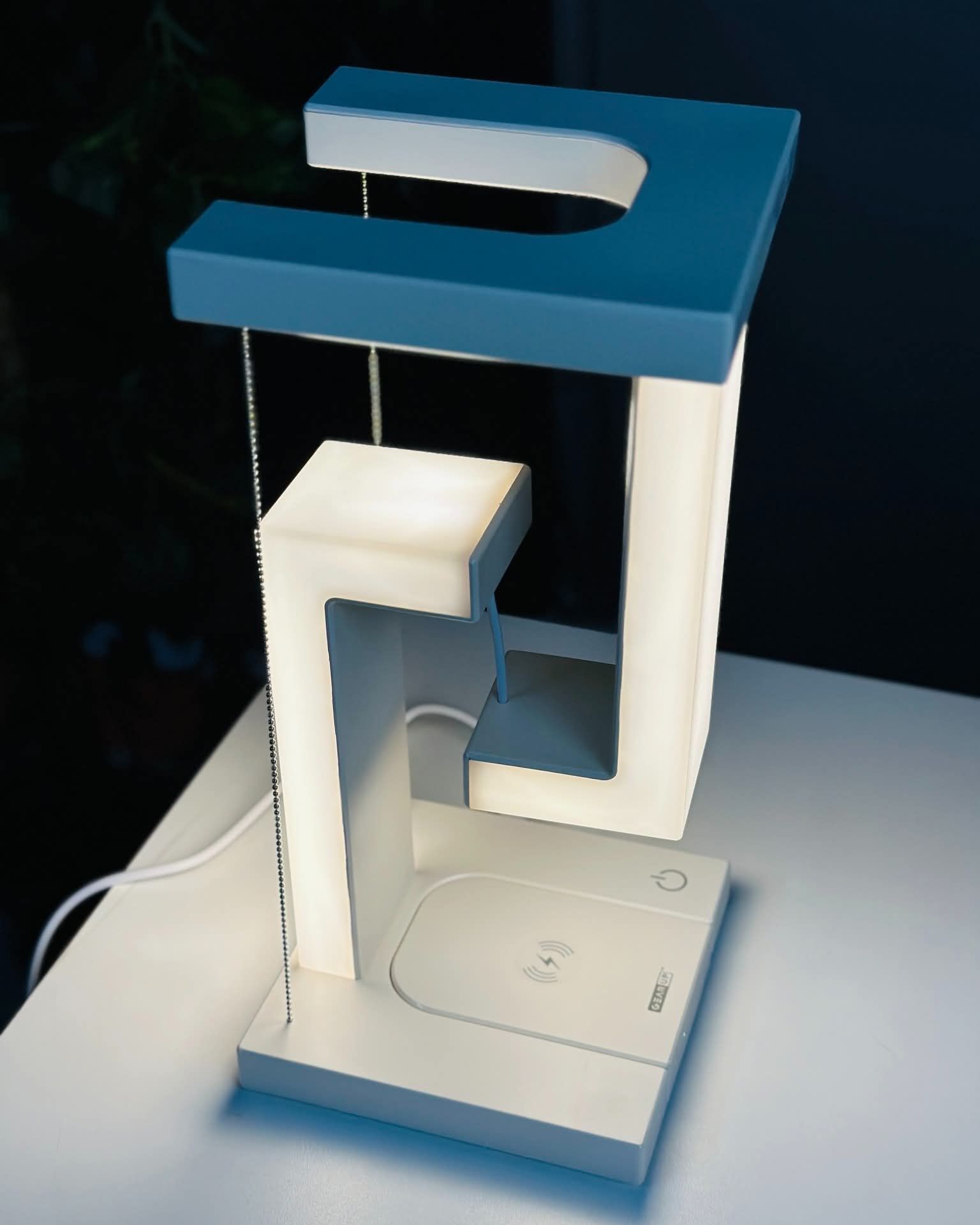 Anti gravity led desk lamp with wireless charger