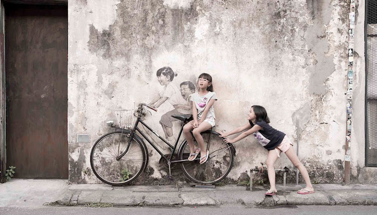 Penang Street Art - Kids on bicycle by Ernest Zacharevic